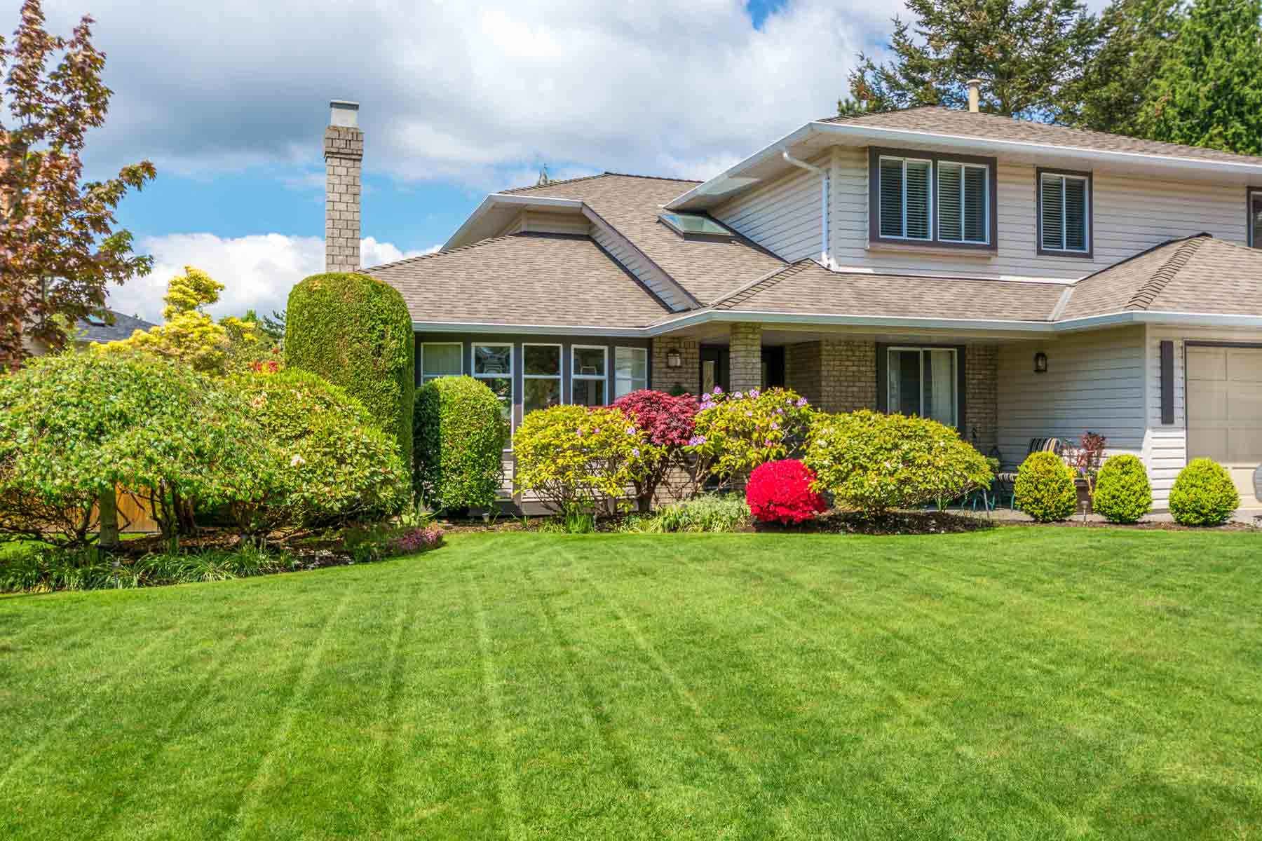 Well maintained residential property with professional trimming and landscaping